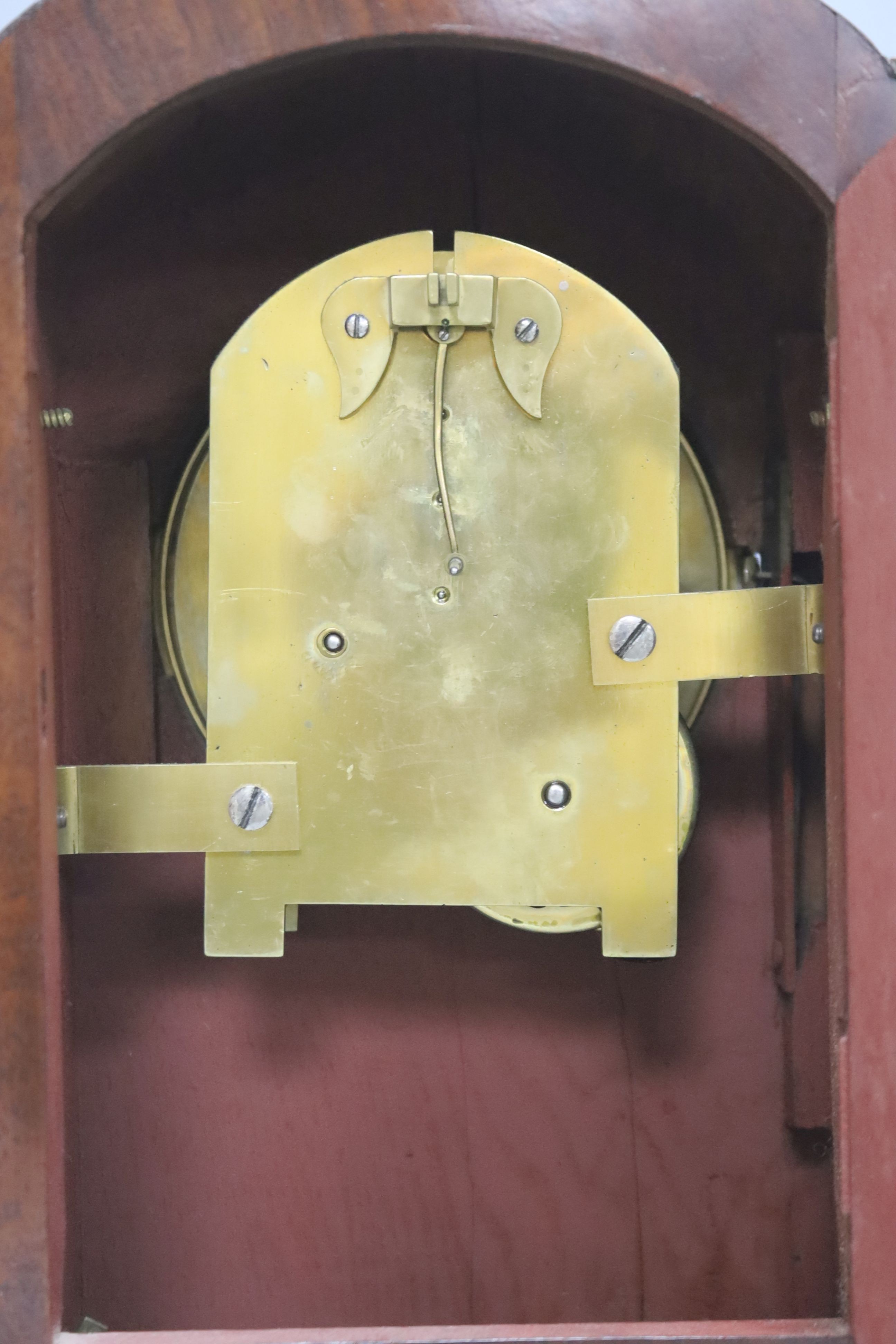 A George IV brass inlaid mahogany mantel clock, with keys and pendulum, height 28cm